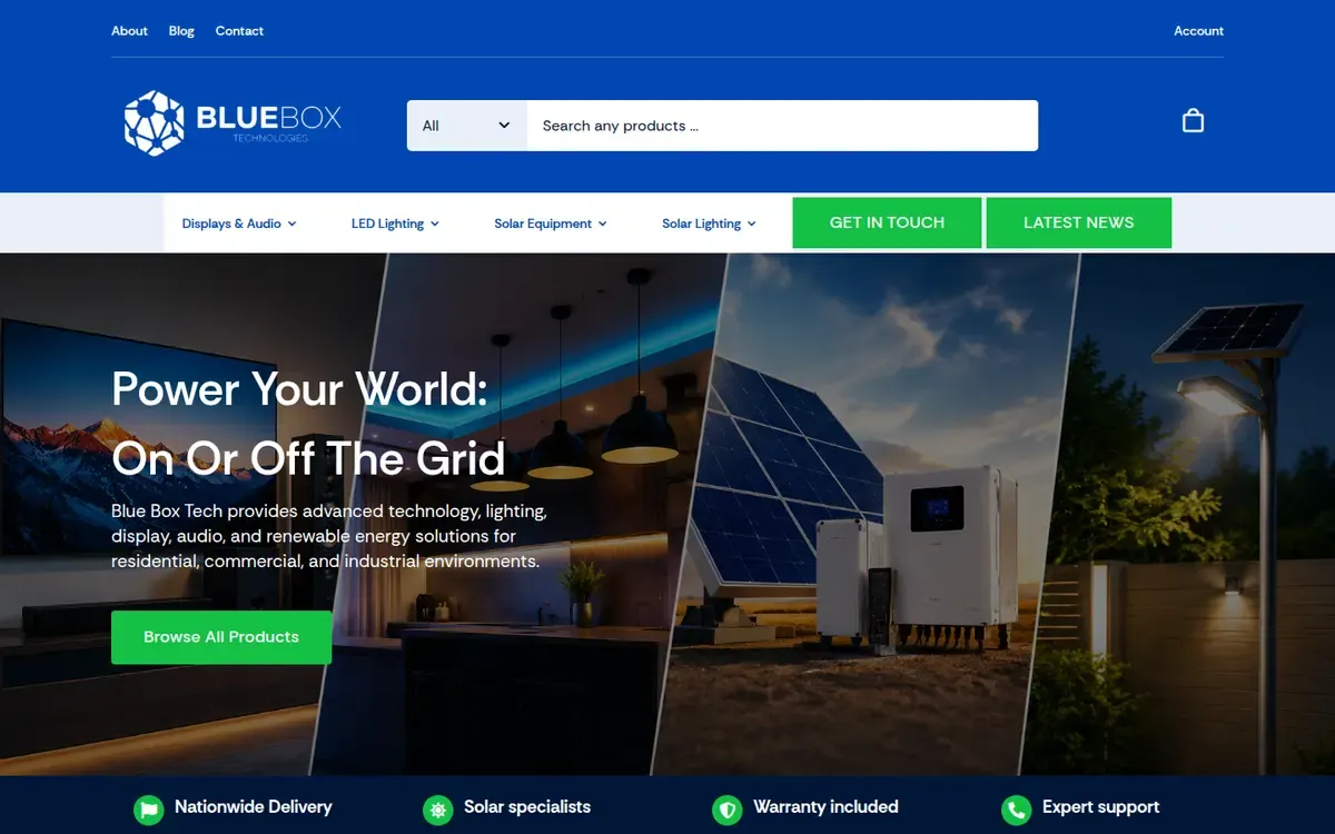 The Blue Box Technologies home page: “Power Your World: On Or Off The Grid” over a split image of a lit living room, solar panels with an inverter, and a solar street light, under a blue header with a product search bar.