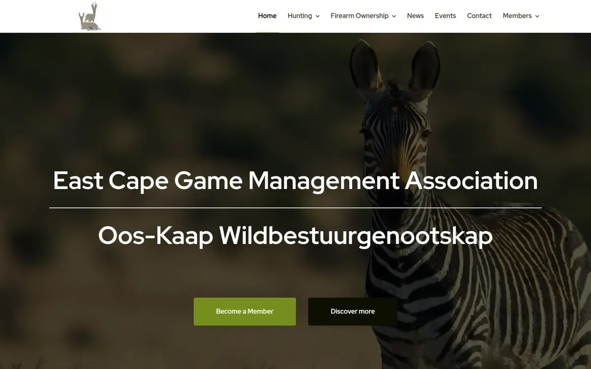 The East Cape Game Management Association home page: a zebra on a dark, blurred background behind the association's English and Afrikaans names, with Become a Member and Discover more buttons.